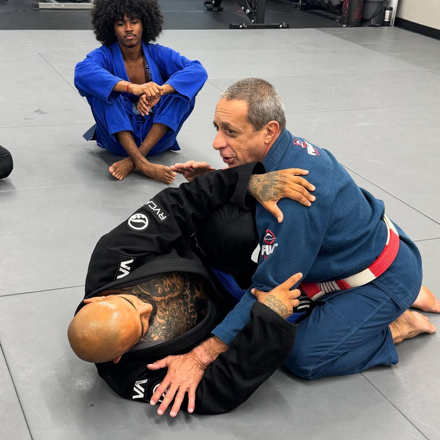 Adult Brazilian Jiu Jitsu class technique at Rollyson BJJ in Hollywood, FL